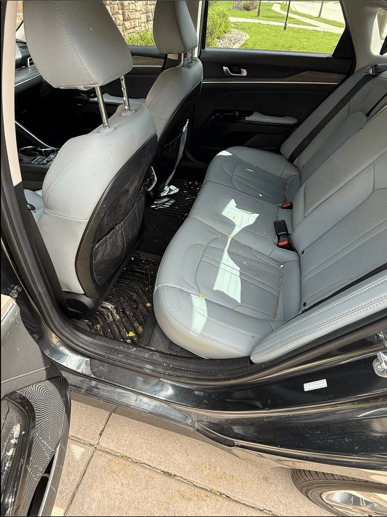 Rear seats vacuumed and cleaned during an interior detail in Overland Park